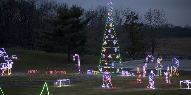 Some outline christmas lights some hockey players a candy cane a Christmas tree and a few other things.