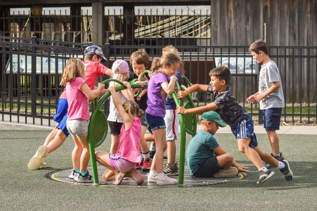 kiddos on a flush-mounted merry-go-round