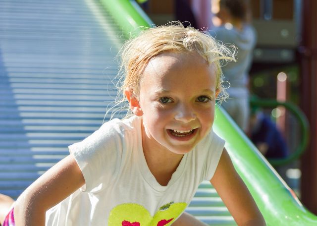 happy kid sliding
