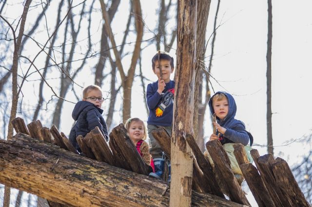 children playing outside on bridge