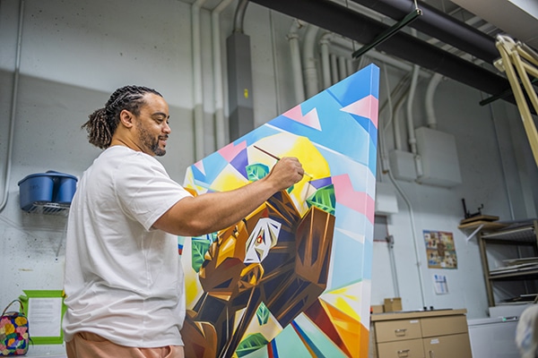 Artist painting on a canvas