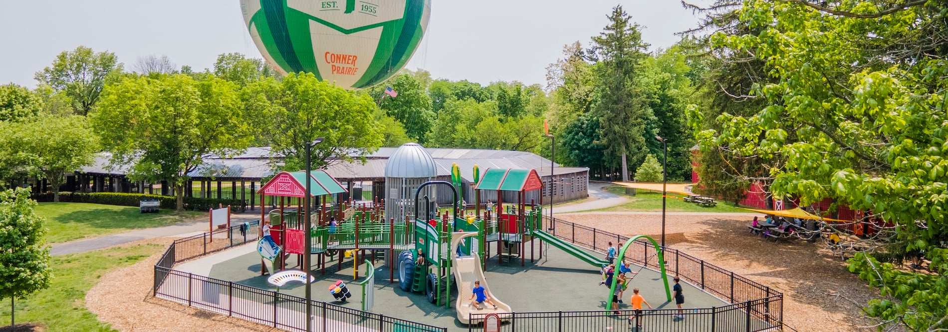 Photo of the Ag Adventures playground with the ginormous balloon in the background.
