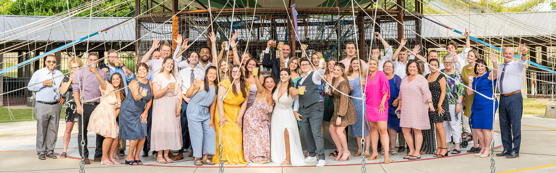 group posing in front of air balloon