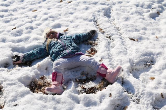 children making snow angels