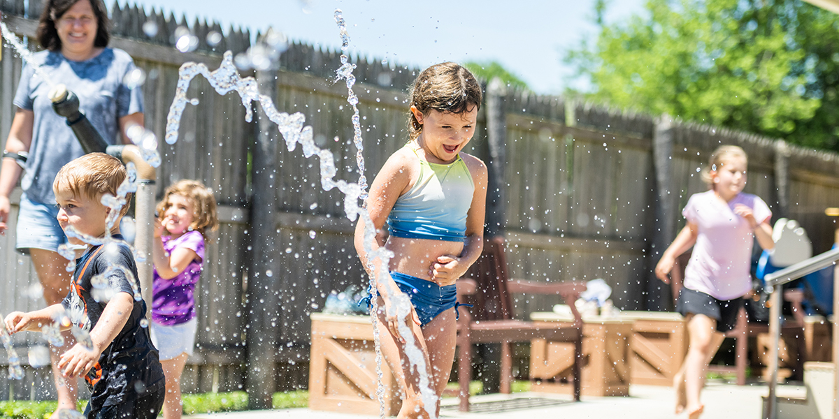 kids playing in water at the splash pad